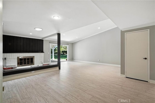 19401 Twin Hills Pl, Porter Ranch, CA 91326 - unfurnished living room featuring light wood-type flooring, recessed lighting, a fireplace, crown molding, and vaulted ceiling