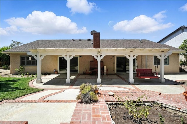 19401 Twin Hills Pl, Porter Ranch, CA 91326 - rear view of house with stucco siding, a patio, and roof with shingles