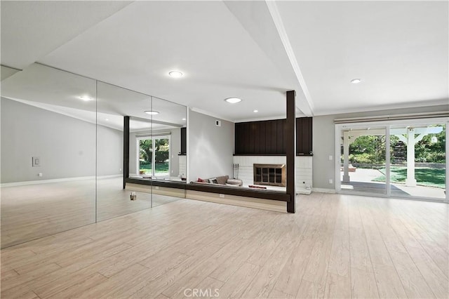 19401 Twin Hills Pl, Porter Ranch, CA 91326 - unfurnished living room featuring light wood-style flooring, ornamental molding, recessed lighting, and a glass covered fireplace