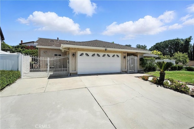19401 Twin Hills Pl, Porter Ranch, CA 91326 - ranch-style house featuring a gate, an attached garage, stucco siding, and driveway