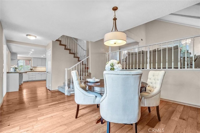 4144 Rainwood Ave, Yorba Linda, CA 92886 - dining room with light wood-style floors, stairs, and lofted ceiling