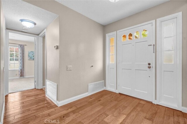 4144 Rainwood Ave, Yorba Linda, CA 92886 - foyer with light wood finished floors and baseboards