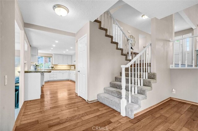 4144 Rainwood Ave, Yorba Linda, CA 92886 - stairway with wood finished floors and baseboards