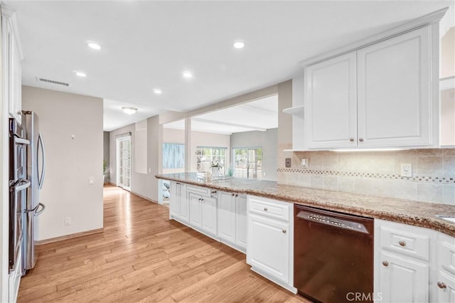 4144 Rainwood Ave, Yorba Linda, CA 92886 - kitchen with black dishwasher, light wood-type flooring, white cabinets, backsplash, and recessed lighting