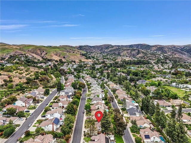 4144 Rainwood Ave, Yorba Linda, CA 92886 - aerial view of property and surrounding area with a mountain backdrop and nearby suburban area