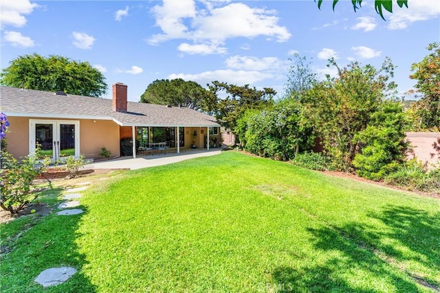 19302 Maynard Way N, Tustin, CA 92705 - view of green lawn featuring a patio and french doors