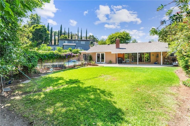19302 Maynard Way N, Tustin, CA 92705 - rear view of property with french doors, a chimney, a patio area, and stucco siding