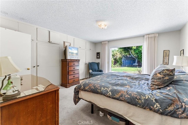 19302 Maynard Way N, Tustin, CA 92705 - bedroom with light carpet, access to outside, and a textured ceiling