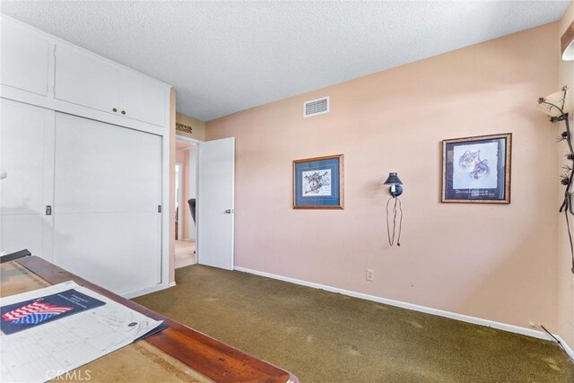 19302 Maynard Way N, Tustin, CA 92705 - unfurnished bedroom featuring dark carpet, a textured ceiling, and a closet