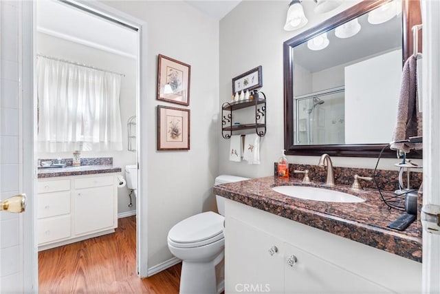 19302 Maynard Way N, Tustin, CA 92705 - bathroom with vanity, wood finished floors, and a shower with door