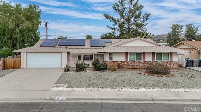 29300 Carmel Rd, Menifee, CA 92586 - ranch-style house with a garage, solar panels, concrete driveway, and roof with shingles