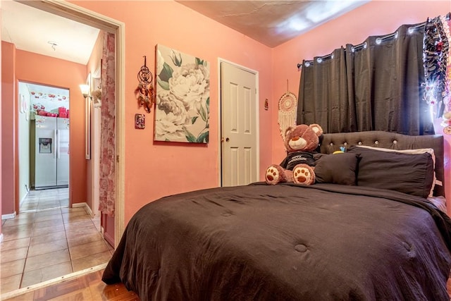 10752 Weigand Ave, Los Angeles, CA 90059 - bedroom with stainless steel fridge and baseboards