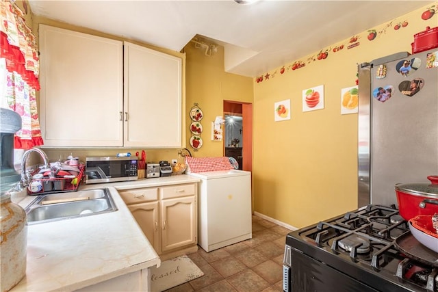 10752 Weigand Ave, Los Angeles, CA 90059 - kitchen featuring stainless steel appliances, light countertops, a sink, and light tile patterned floors