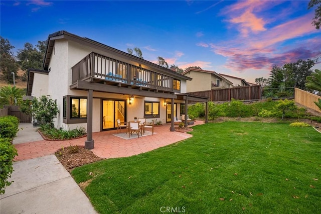 2959 Butler St, Oceanside, CA 92054 - back of house at dusk with stucco siding, a patio area, and a deck