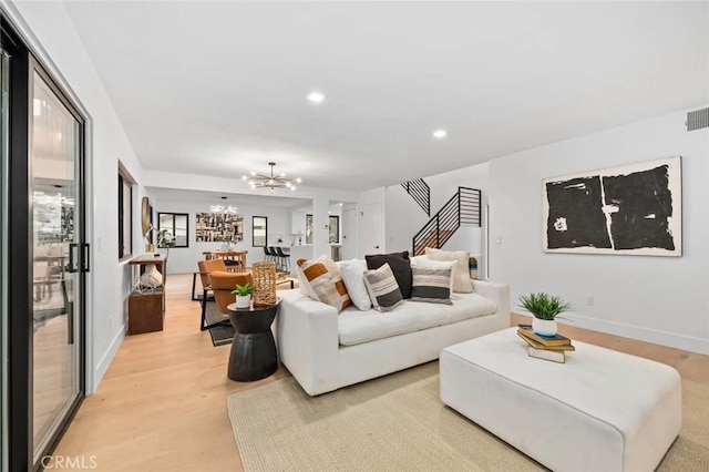 2959 Butler St, Oceanside, CA 92054 - living room featuring a chandelier, light wood-style flooring, recessed lighting, and baseboards