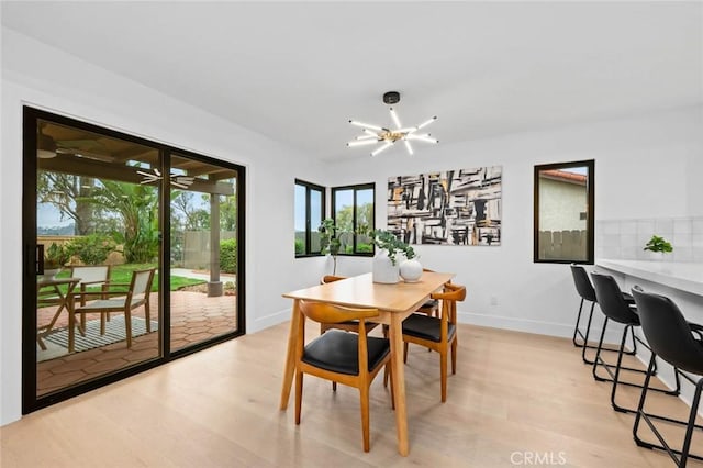 2959 Butler St, Oceanside, CA 92054 - dining room featuring light wood finished floors, a chandelier, and baseboards