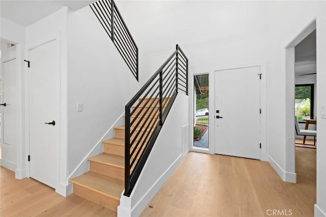 2959 Butler St, Oceanside, CA 92054 - foyer with light wood-style floors, stairs, and baseboards