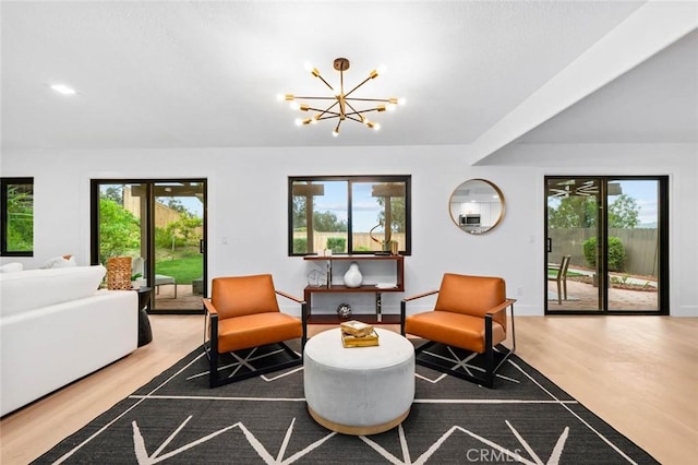 2959 Butler St, Oceanside, CA 92054 - living area featuring healthy amount of natural light, wood finished floors, a chandelier, and baseboards