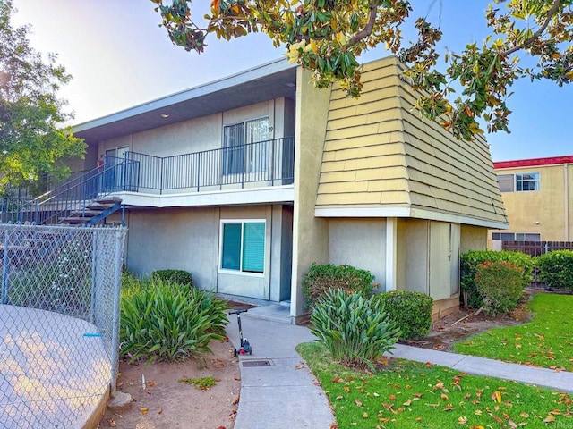 166 N 1st St Unit 18, El Cajon, CA 92021 - view of front of home with stucco siding and a balcony