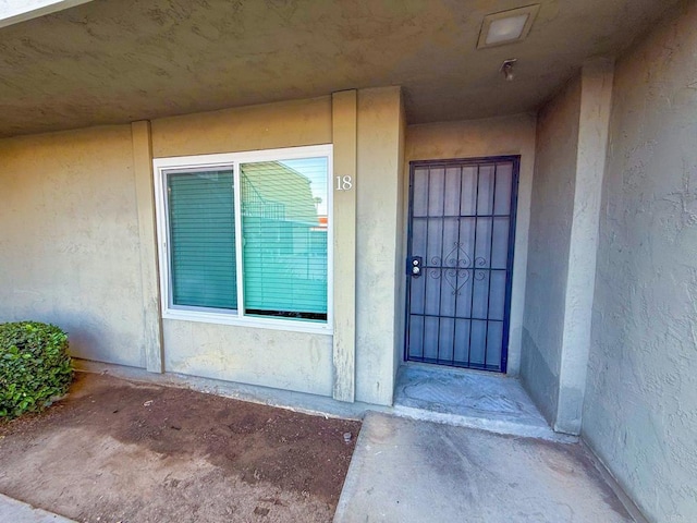 166 N 1st St Unit 18, El Cajon, CA 92021 - doorway to property with stucco siding