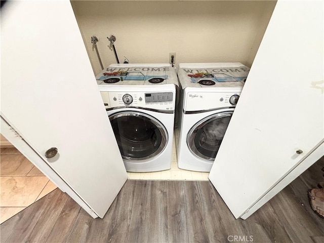 13955 Arthur Ave Unit 4, Paramount, CA 90723 - washroom featuring washer and clothes dryer and wood finished floors