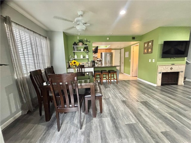 13955 Arthur Ave Unit 4, Paramount, CA 90723 - dining room featuring wood finished floors, ceiling fan, and baseboards