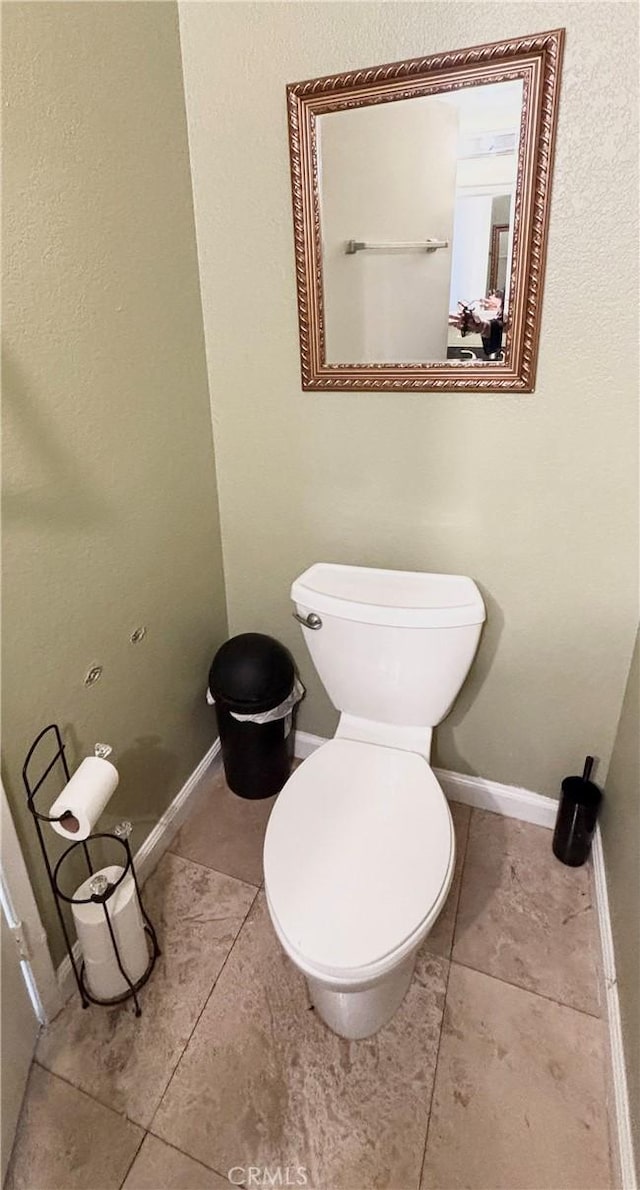 13955 Arthur Ave Unit 4, Paramount, CA 90723 - bathroom with toilet, baseboards, and tile patterned floors