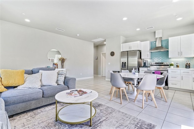 13176 Quinta Way, Desert Hot Springs, CA 92240 - living room with light tile patterned floors, recessed lighting, and baseboards