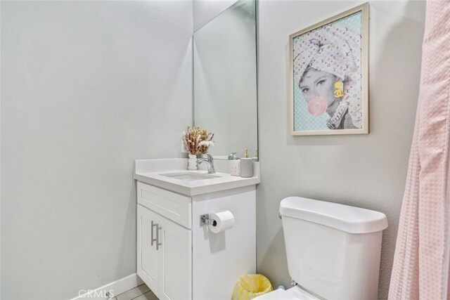 13176 Quinta Way, Desert Hot Springs, CA 92240 - bathroom featuring vanity, toilet, and tile patterned flooring