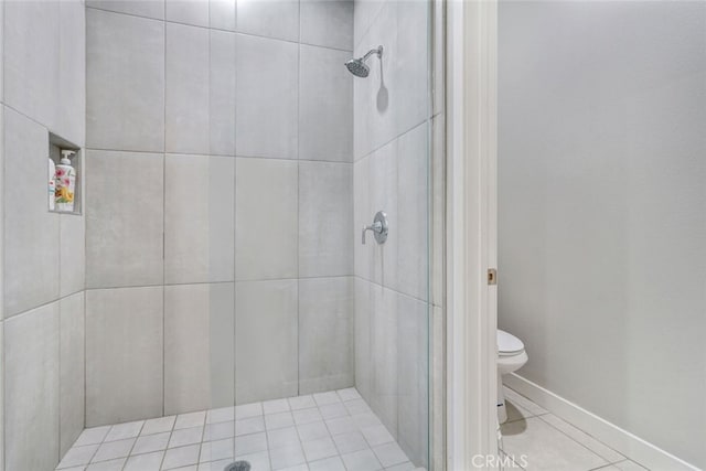 13176 Quinta Way, Desert Hot Springs, CA 92240 - bathroom featuring toilet, a stall shower, and baseboards
