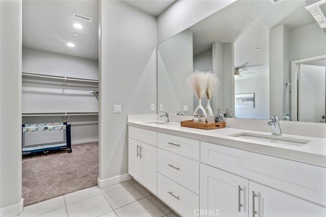 13176 Quinta Way, Desert Hot Springs, CA 92240 - full bathroom featuring double vanity, tile patterned floors, baseboards, and a walk in closet