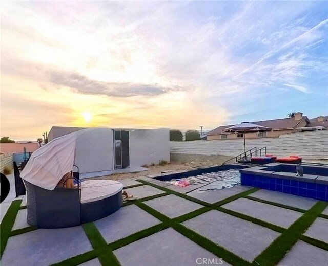 13176 Quinta Way, Desert Hot Springs, CA 92240 - back of house featuring a fenced backyard, a patio area, and a hot tub