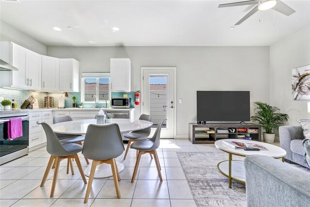 13176 Quinta Way, Desert Hot Springs, CA 92240 - dining space with light tile patterned floors, ceiling fan, and recessed lighting