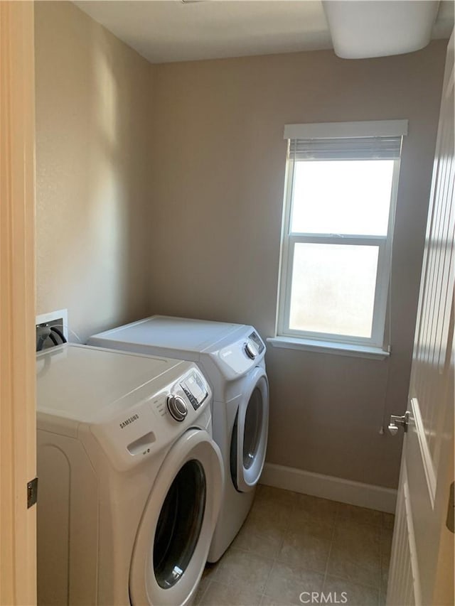 538 Burnt Ranch Way, Chico, CA 95973 - laundry room with washer and clothes dryer and light tile patterned flooring