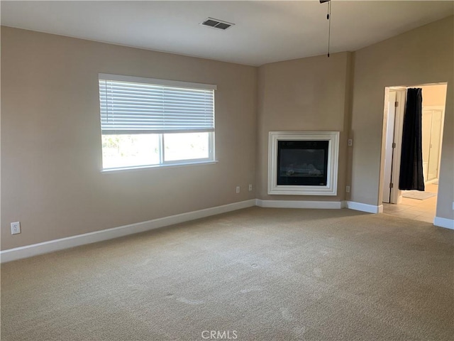 538 Burnt Ranch Way, Chico, CA 95973 - unfurnished living room featuring light colored carpet and a glass covered fireplace