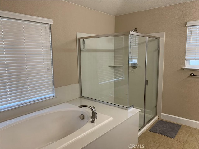 538 Burnt Ranch Way, Chico, CA 95973 - bathroom with a shower stall, a bath, a textured wall, tile patterned floors, and a textured ceiling