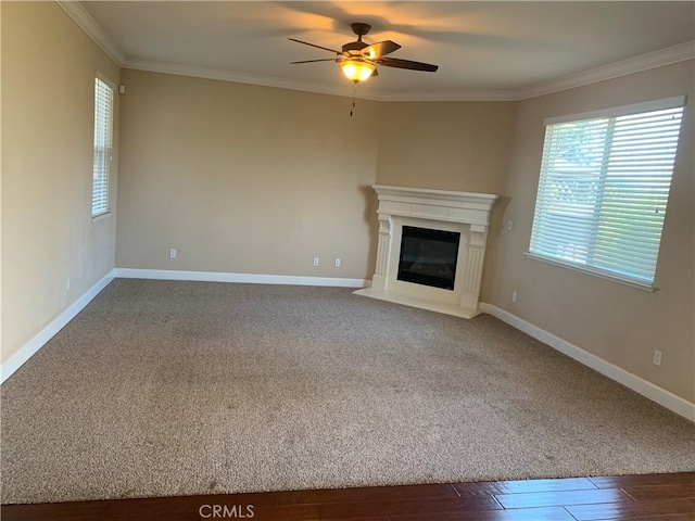 538 Burnt Ranch Way, Chico, CA 95973 - unfurnished living room featuring plenty of natural light, ceiling fan, crown molding, a glass covered fireplace, and wood finished floors