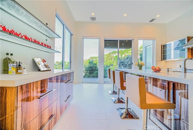 3964 Sumac Dr, Sherman Oaks, CA 91403 - bar with light tile patterned floors, recessed lighting, and a sink