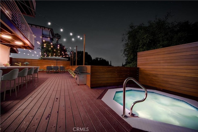 3964 Sumac Dr, Sherman Oaks, CA 91403 - deck at night with a grill and a pool