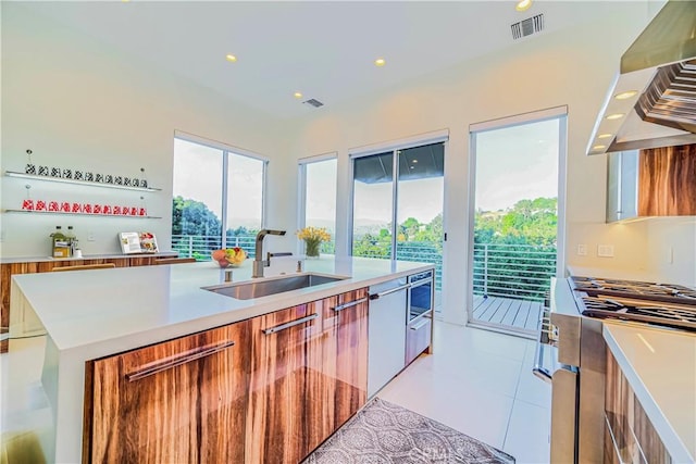 3964 Sumac Dr, Sherman Oaks, CA 91403 - kitchen featuring a sink, wall chimney exhaust hood, modern cabinets, stove, and recessed lighting