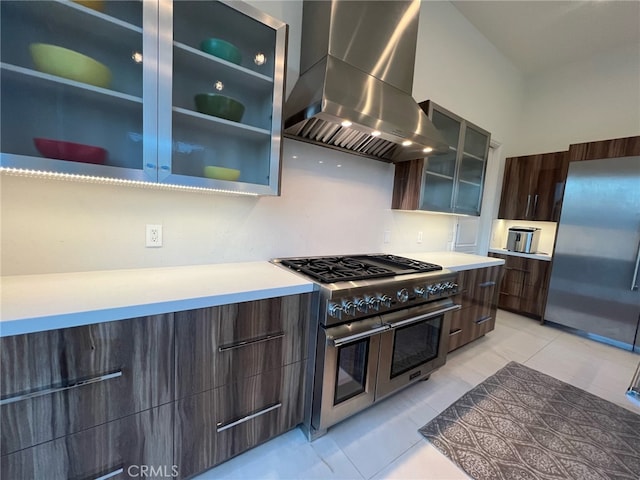 3964 Sumac Dr, Sherman Oaks, CA 91403 - kitchen featuring stainless steel appliances, wall chimney exhaust hood, modern cabinets, and light countertops
