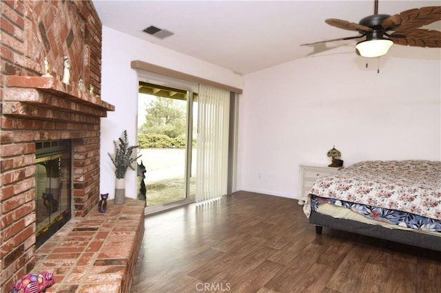 19180 Osceola Rd, Apple Valley, CA 92307 - bedroom featuring access to outside, wood finished floors, a fireplace, and baseboards