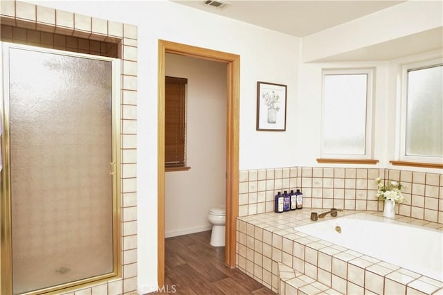 19180 Osceola Rd, Apple Valley, CA 92307 - full bathroom with toilet, wood finished floors, a shower stall, a bath, and baseboards