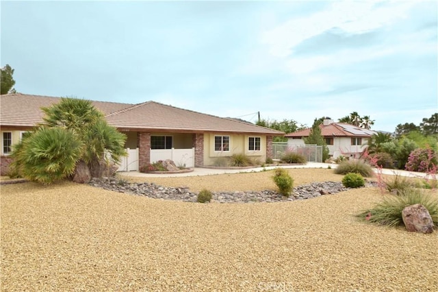 19180 Osceola Rd, Apple Valley, CA 92307 - ranch-style house with a tiled roof and stucco siding