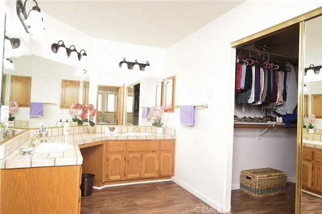 19180 Osceola Rd, Apple Valley, CA 92307 - full bathroom featuring vanity, wood finished floors, and a spacious closet