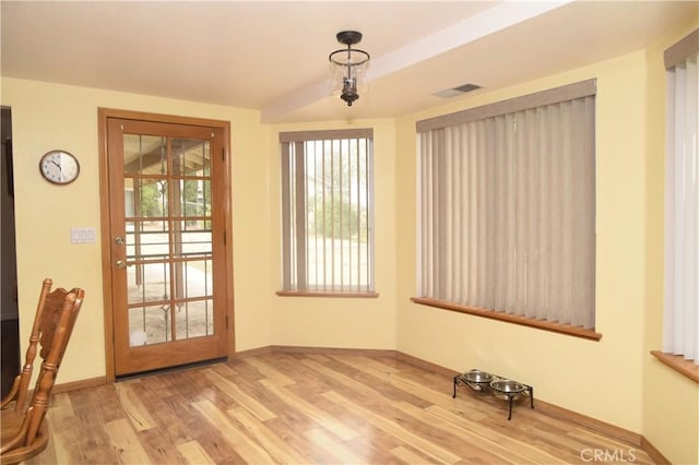 19180 Osceola Rd, Apple Valley, CA 92307 - unfurnished dining area with light wood-style flooring and baseboards