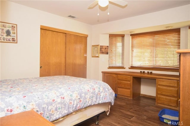 19180 Osceola Rd, Apple Valley, CA 92307 - bedroom featuring dark wood finished floors, a closet, a desk, and ceiling fan