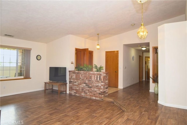 19180 Osceola Rd, Apple Valley, CA 92307 - unfurnished living room featuring wood finished floors, baseboards, a textured ceiling, and a chandelier