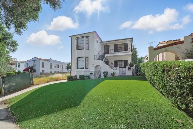 1327 S Burnside Ave, Los Angeles, CA 90019 - back of house featuring stairway, stucco siding, and a residential view
