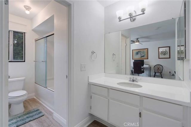 28215 Paseo El Siena Unit 46, Laguna Niguel, CA 92677 - full bathroom featuring ceiling fan, vanity, enclosed tub / shower combo, and wood finished floors